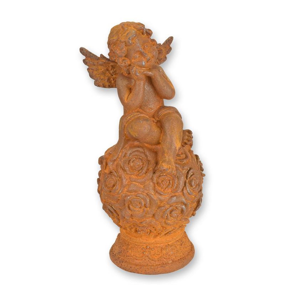 A RUSTY CAST IRON FIGURINE OF A PUTTO SITTING ON BALL