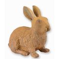 A RUSTY CAST IRON FIGURINE OF A RABBIT