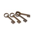 A SET OF 4 CAST IRON KEY SHAPED BOTTLE OPENERS
