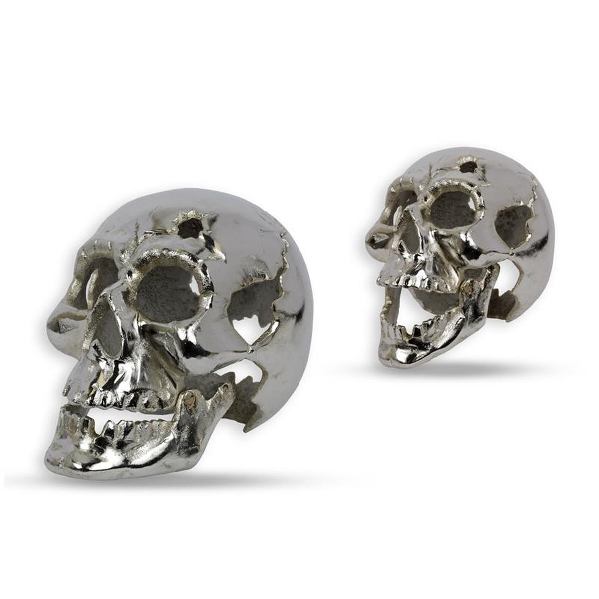 A SILVER PAINTED CAST IRON SKULL