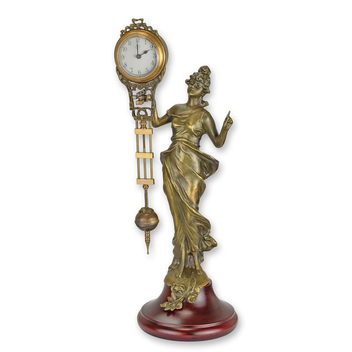 A TABLE CLOCK MYSTERIEUSE HELT BY A DRESSED WOMAN