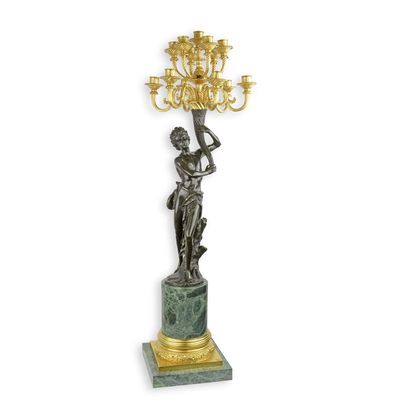 A THIRTEEN-LIGHT BRONZE FIGURAL CANDELABRUM ON MARBLE BASE