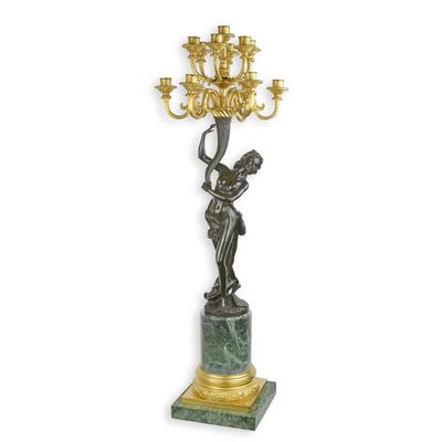 A THIRTEEN-LIGHT BRONZE FIGURAL CANDELABRUM ON MARBLE BASE