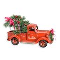 A TIN MODEL OF A CHRISTMAS STYLE PICK UP TRUCK