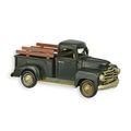 A TIN MODEL OF A PICKUP TRUCK