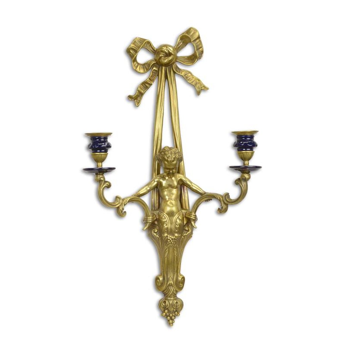 A TWO LIGHT PORCELAIN MOUNTED BRONZE WALL APPLIQUE