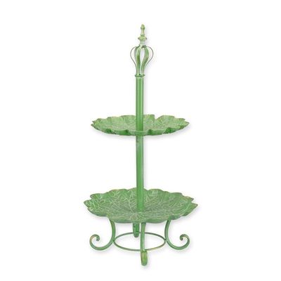 A TWO-TIER TIN CAKE STAND