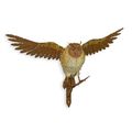 A WALL MOUNT IRON OWL ON BRANCH