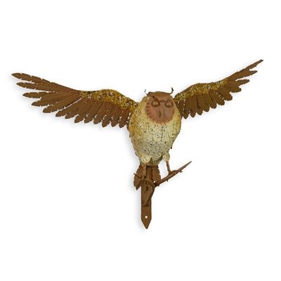 A WALL MOUNT IRON OWL ON BRANCH