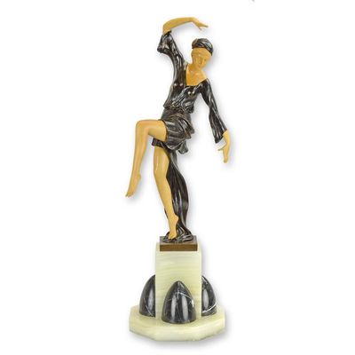 A WOOD MOUNTED BRONZE SCULPTURE OF THE AUTUMN DANCER