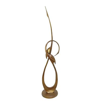 AN ABSTRACT BRONZE SCULPTURE OF TWO CRANES