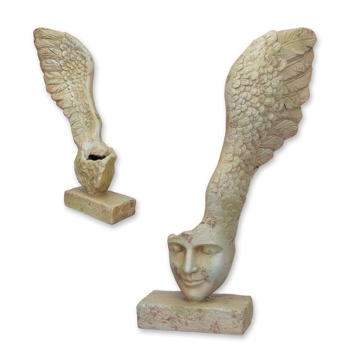 AN ANTIQUE STYLE MGO WINGED FACE PLANTER