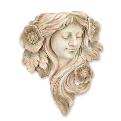 AN ANTIQUE STYLE WALL MOUNT FACE PLANTER