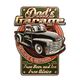 AN EMBOSSED TIN PLATE - DAD'S GARAGE