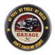 AN EMBOSSED TIN PLATE - GARAGE