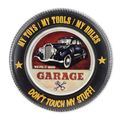 AN EMBOSSED TIN PLATE - GARAGE
