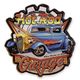 AN EMBOSSED TIN PLATE - HOT ROD GARAGE