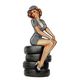 AN EMBOSSED TIN PLATE - LADY ON TIRES
