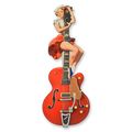AN EMBOSSED TIN PLATE - PIN-UP CLIMBING A GUITAR