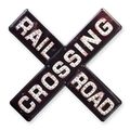 AN EMBOSSED TIN PLATE - RAILROAD CROSSING