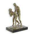 AN EROTIC BRONZE SCULPTURE OF A COUPLE MAKING LOVE