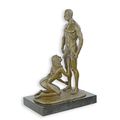 AN EROTIC BRONZE SCULPTURE OF A FEMALE GIVING ORAL SEX
