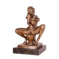 AN EROTIC BRONZE SCULPTURE OF A FEMALE NUDE ON TOILET