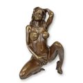 AN EROTIC BRONZE SCULPTURE OF A FEMALE NUDE