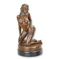 AN EROTIC BRONZE SCULPTURE OF A FEMALE NUDE