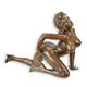 AN EROTIC BRONZE SCULPTURE OF A FEMALE NUDE