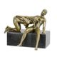 AN EROTIC BRONZE SCULPTURE OF A NUDE COUPLE