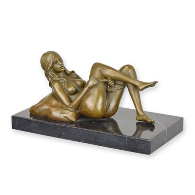 AN EROTIC BRONZE SCULPTURE OF A RECLINING FEMALE