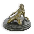 AN EROTIC BRONZE SCULPTURE OF A RECLINING FEMALE NUDE