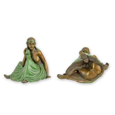 AN EROTIC BRONZE SCULPTURE OF A SEMI NUDE WOMAN