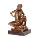 AN EROTIC BRONZE SCULPTURE OF SEMI NUDE FEMALE TAKING OFF HE