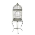 AN IRON BIRD CAGE ON STAND