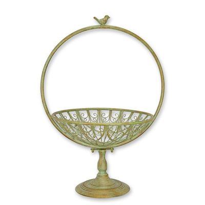 AN IRON FLOWER BASKET