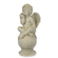 AN MGO SCULPTURE OF A PUTTO BLOWING A KISS