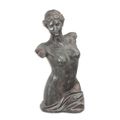 AN MGO TORSO OF A FEMALE NUDE