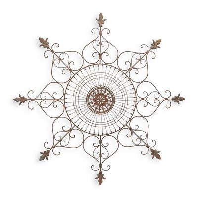 AN ORNAMENTAL IRON WALL DECOR