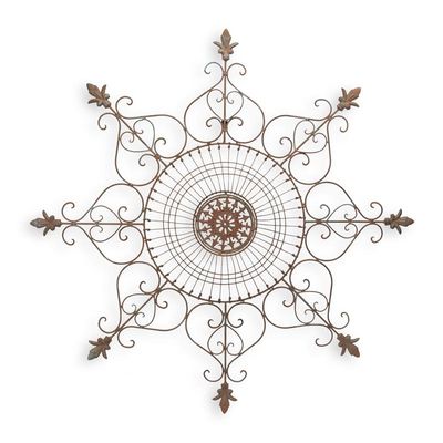 AN ORNAMENTAL IRON WALL DECOR